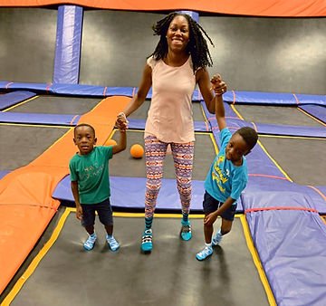 Family day at a trampoline gym.
