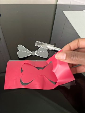 Cut the minnie bow out of the cricut sheet